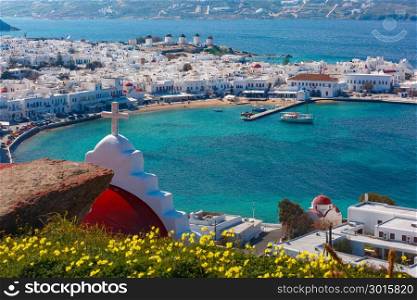 Mykonos City, Chora on island Mykonos, Greece. Aerial view of Mykonos City, Chora with Old Port, white houses, windmilles and churches on the island Mykonos, The island of the winds, Greece