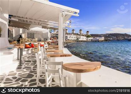 Mykonos island,Cyclades. Greece summer holidays. Bars by the sea in famous popular place  Little Venice . 