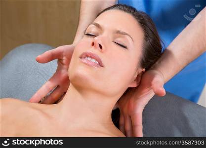 myofascial therapy on beautiful woman shoulders by therapist hands