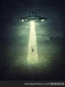 Mysterious alien spaceship abduction scene. Surreal concept with a levitating human stolen by the light of an UFO ship in a dark night on a open field