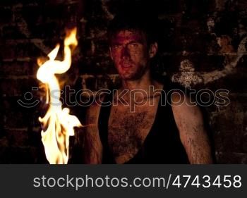 Mysterious man with torch in hand