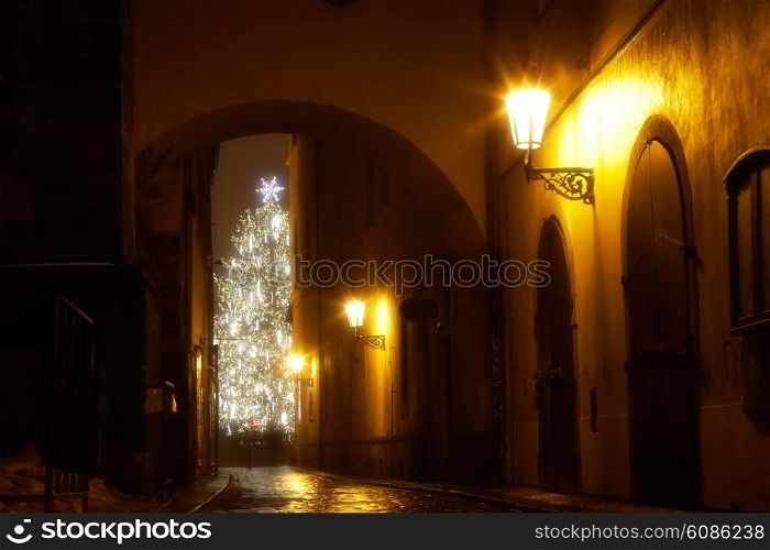 mysterious narrow alley with christmas tree in Prague