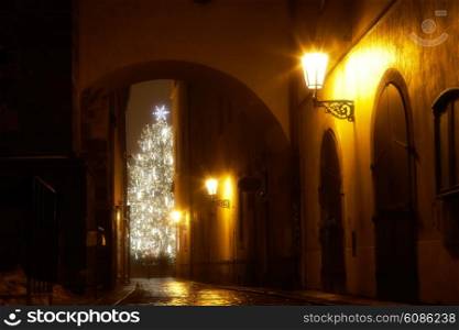 mysterious narrow alley with christmas tree in Prague
