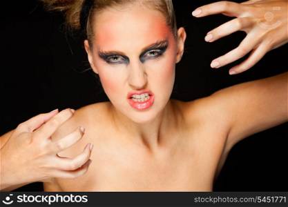 Mysterious woman with extravagant make up and scaring expression&#xA;