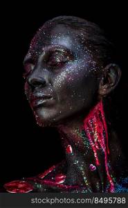 Mystical woman makeup with sparkles and luminous elements on a dark background. Mystical makeup of a woman in the dark