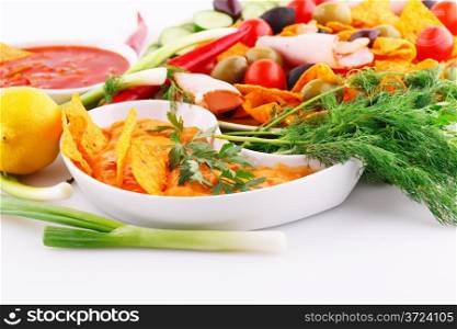 Nachos, cheese and red sauce, vegetables image.