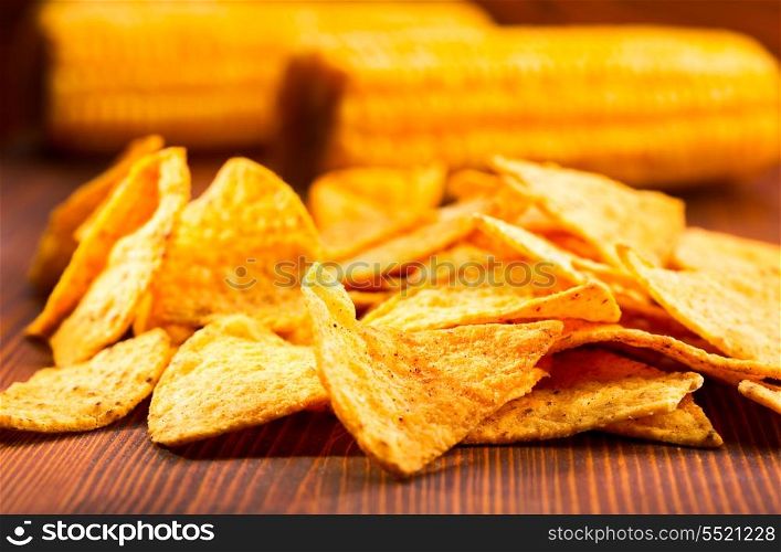 nachos with corn on wooden table