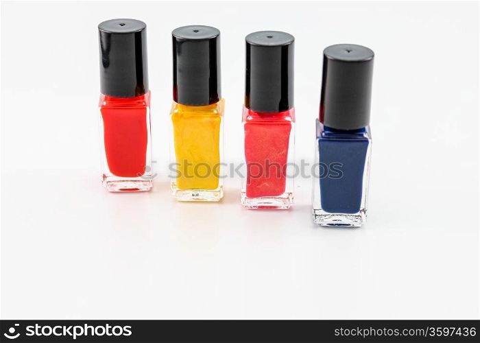 Nail polish arrangement of 4 bottles in different shades