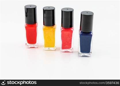 Nail polish arrangement of 4 bottles in different shades