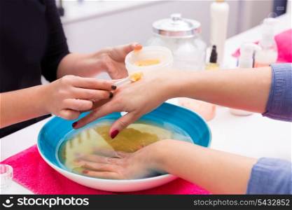 Nail saloon scrub bath exfoliant hands skin renewal in bowl water