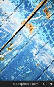 nail stripped paint in the blue wood door and rusty