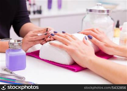 Nails saloon woman nail polish remove with tissue for new manicure