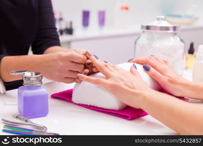 Nails saloon woman nail polish remove with tissue for new manicure