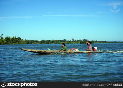 NAKASONG, LAOS - CIRCA JANUARY 2017 Boat on Mekong with two women