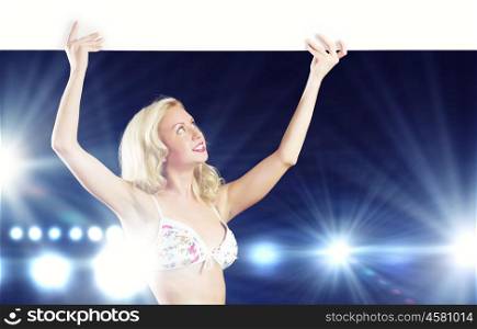 Naked girl with banner. Girl in swim wear holding white blank banner above head. Place for text