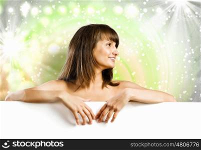 Naked girl with banner. Young attractive woman with blank banner. Place for text