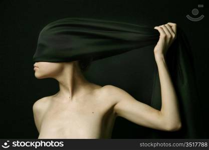 Naked (nude) woman with black bandage. Artistic photo.
