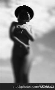 naked woman in a hat. Black and white photography
