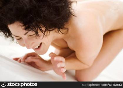 Naked woman laughing
