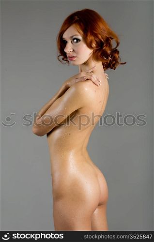 naked woman on a gray background