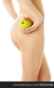 naked woman with green apple over white