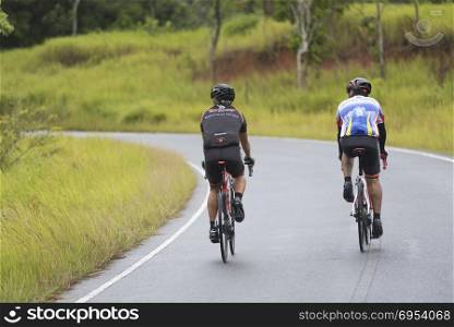 Nakornratchasima, Thailand - March 20, 2016: Activities of Mountain Bikers challenging themselves uphill on a Long Weekend Sporting and Fitness at Khao yai national park.