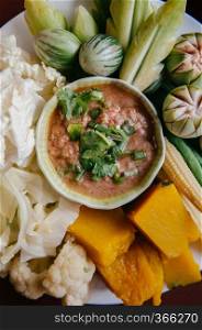 Nam Prik Pla To - Thai chili paste dip with mackerel fish meat and fresh vegetables, pumpkin, cucumber, bean and cauliflower