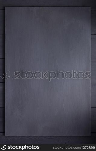 nameplate at black wooden background texture surface