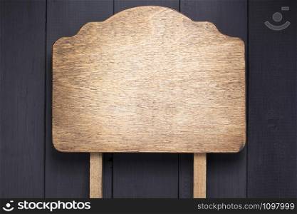 nameplate at black wooden background texture surface