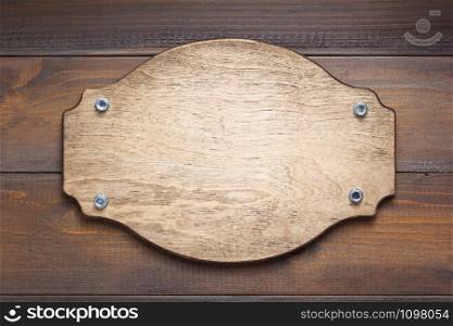 nameplate at wooden background texture, on plank board wall