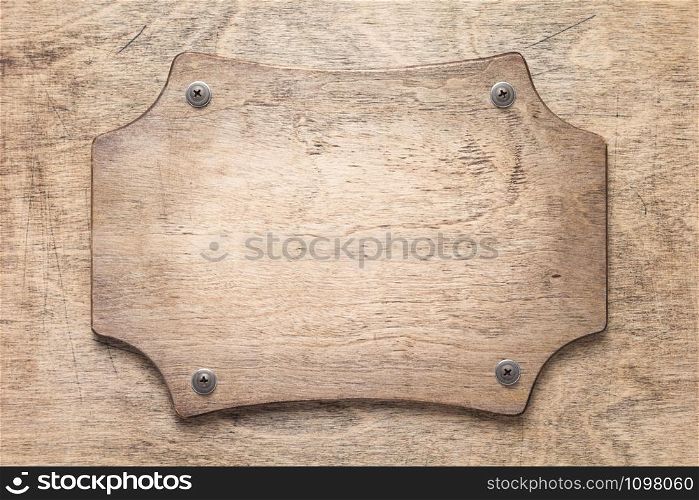 nameplate at wooden background texture, on plank board wall
