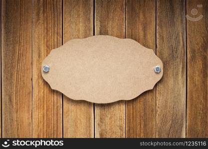 nameplate or wall sign at wooden background texture surface, with screws