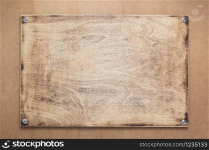 nameplate or wall sign at wooden mdf boards background as texture surface