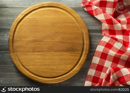 napkin at cutting board on wooden background