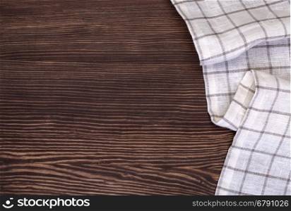 Napkin on the wooden background. Top view.