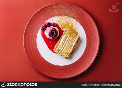 Napoleon cake with vanilla ice cream with cherry jam