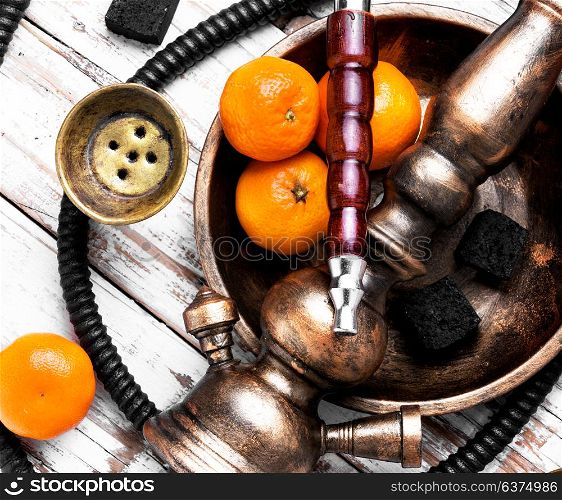Nargile with mandarin. Smoking smoking shisha in east style with tobacco aroma of mandarin.
