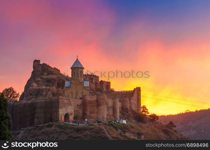 Narikala at gorgeous sunset, Tbilisi, Georgia. Amazing View of Narikala ancient fortress with St Nicholas Church at gorgeous sunset, Tbilisi, Georgia.