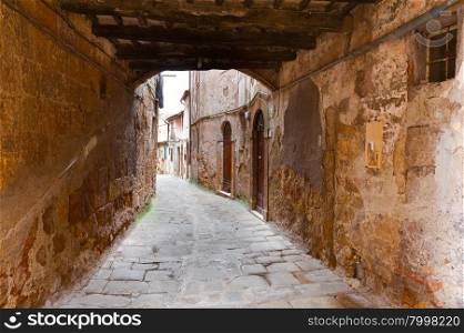 Narrow Alley with Arch in Italian City of Sorano