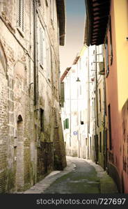 Narrow alley with medieval houses in the Italian city of Pisa. Vintage style.