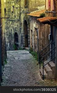 Narrow Alley with Old Buildings in Italian City of Cave, Vintage Style Toned Picture