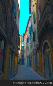 Narrow Alley With Old Buildings In Italian City of Lucca