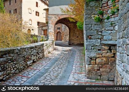 Narrow Alley with Old Buildings in the Italian City of Todi