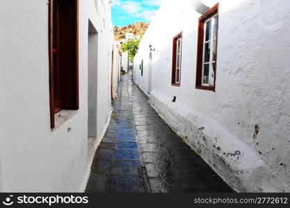 Narrow Alley With Old Buildings In Typical Greek City