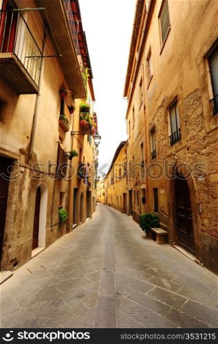Narrow Alley With Old Buildings In Typical Italian Medieval Town