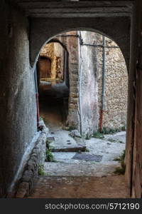 Narrow archway at the old street in the village Coaraze, France