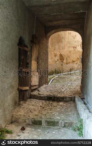 Narrow archway at the old street in the village Coaraze, France