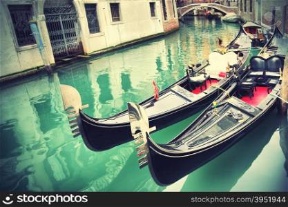 Narrow canal with gondolas in Venice, Italy (Retro Style)