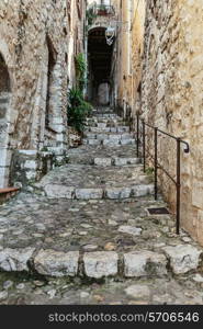 Narrow cobbled street in the old village France.