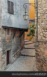 Narrow cobbled street in the old village Tourrettes-sur-Loup , France.